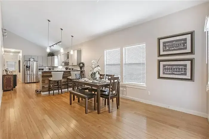 Dining area open to the kitchen with hardwood floors